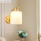 Modern 1-Light Brass Cylinder Sconce With Milk Glass Shade - Wall Lighting Fixture