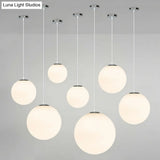 Modern 1 Light Glass Ball Pendant For Clothing Store Ceiling Simple & White
