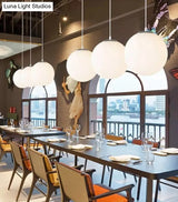 Modern 1 Light Glass Ball Pendant For Clothing Store Ceiling Simple & White