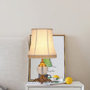 Modern Bell Fabric Table Lamp With Carved Bronze Metallic Base - Beige
