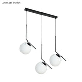 Modern Black Glass Orb Cluster Pendant Light With Angled Arm - 3-Light Ceiling Lamp
