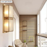 Modern Brass Wall Sconce With Frosted Glass - Sleek Corridor Lighting