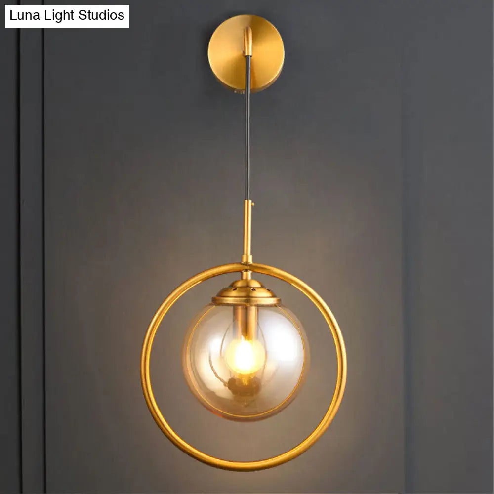 Modern Brass Wall Sconce With Glass Sphere Shade For Bedside Lighting