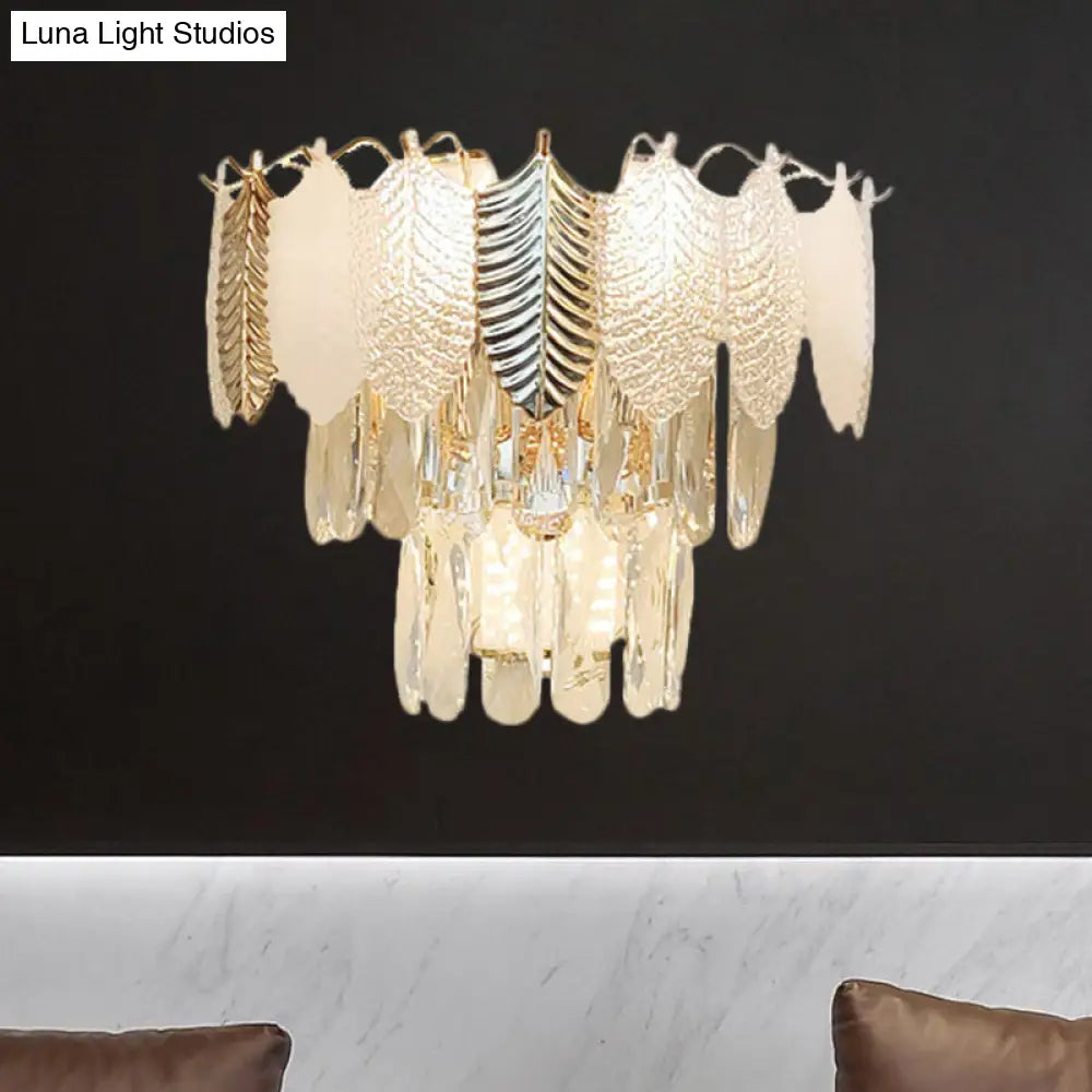Modern Crystal Wall Sconce With Tapered Design Golden Accents And Acrylic Leaves