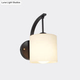 Modern Cylindrical Wall Sconce With Black Finish And Opal Glass Shade