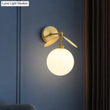Modern Globe/Oval Wall Mount Lamp With Cream Glass - Brass Bedside Light Leaf Deco
