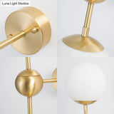 Modern Globe Wall Sconce Light In Brass With White Glass - Bathroom Lighting Fixture