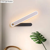 Modern Hour Hand Led Wall Sconce In Black And White Acrylic With White/Warm Lighting