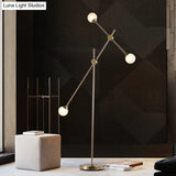 Modern Metal Orb Floor Lamp With Swing Arm Gold Led Lighting & White Glass Shade