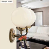 Modern Opal Glass Sconce Light With Globe Shade In Antique Brass/Chrome