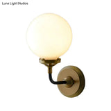 Modern Opal Glass Sconce Light With Globe Shade In Antique Brass/Chrome