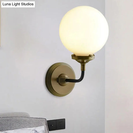 Modern Opal Glass Sconce Light With Globe Shade In Antique Brass/Chrome