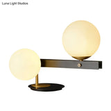 Modern Opal Glass Sphere Table Light With Black Metal Base - 2 Bulbs Small Desk Lamp