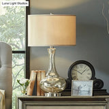 Modern Silver Glass Nightstand Lamp With Beige Fabric Shade