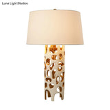 Modern Tapered Drum Fabric Night Lamp - Stylish White Table With Cutouts Resin Base