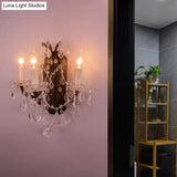 Modern Teardrop Crystal Candelabra Sconce Light - White Wall Mount With Rust Backplate (3 Lights)