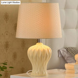 Modern White Fabric Barrel Task Lamp With Ceramic Urn Base - 1 Bulb Table Light