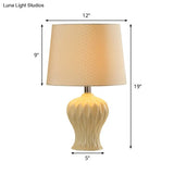 Modern White Fabric Barrel Task Lamp With Ceramic Urn Base - 1 Bulb Table Light