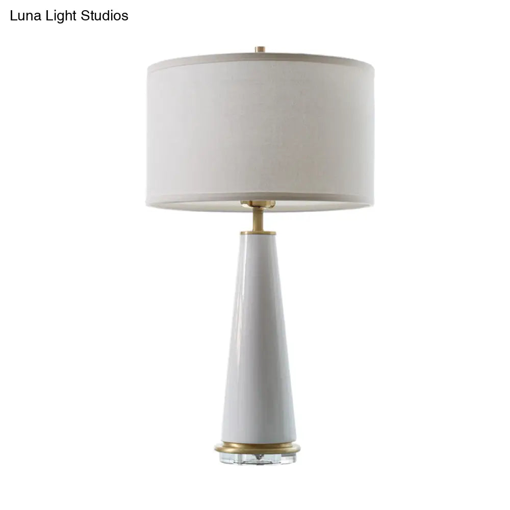 Modern White Fabric Cylinder Table Light With Cone Ceramic Base - 1 Bulb Desk Lamp