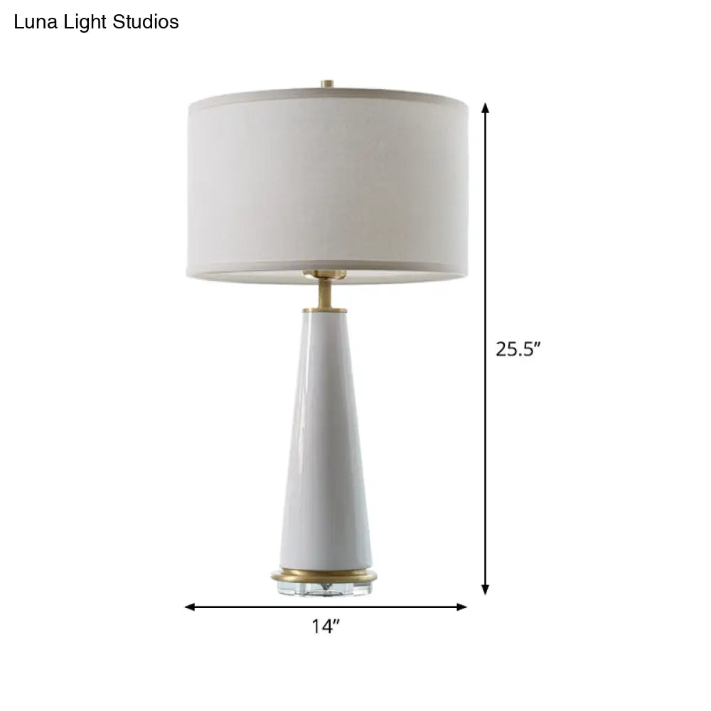 Modern White Fabric Cylinder Table Light With Cone Ceramic Base - 1 Bulb Desk Lamp
