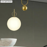 Modern White Glass Sphere Pendant Light With Golden Hanging Fixture For Bedrooms