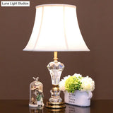 Modern White Table Lamp With Flared Shape And Fabric Shade Perfect For Task Lighting