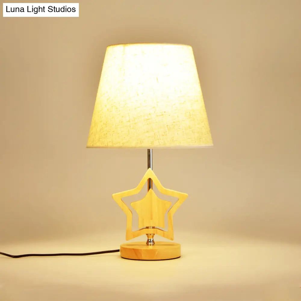 Modern Wood Star Nightstand Lamp With Beige Barrel Fabric Shade