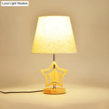 Modern Wood Star Nightstand Lamp With Beige Barrel Fabric Shade
