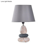 Modernist Led Night Table Lamp In Black/Grey Ceramic Stone Shape With Fabric Shade