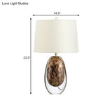 Modernist White Fabric Table Lamp With Colored Glaze Base - Oval Drum Nightstand Light