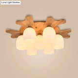 Nordic Cream Glass Bell Flush Ceiling Light With Antler Top And Wood Accents