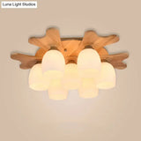 Nordic Cream Glass Bell Flush Ceiling Light With Antler Top And Wood Accents