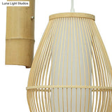 Oriental Oval Wall Light Sconce With Bamboo Lantern Design - 1-Light Beige Lamp