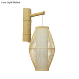 Oriental Oval Wall Light Sconce With Bamboo Lantern Design - 1-Light Beige Lamp