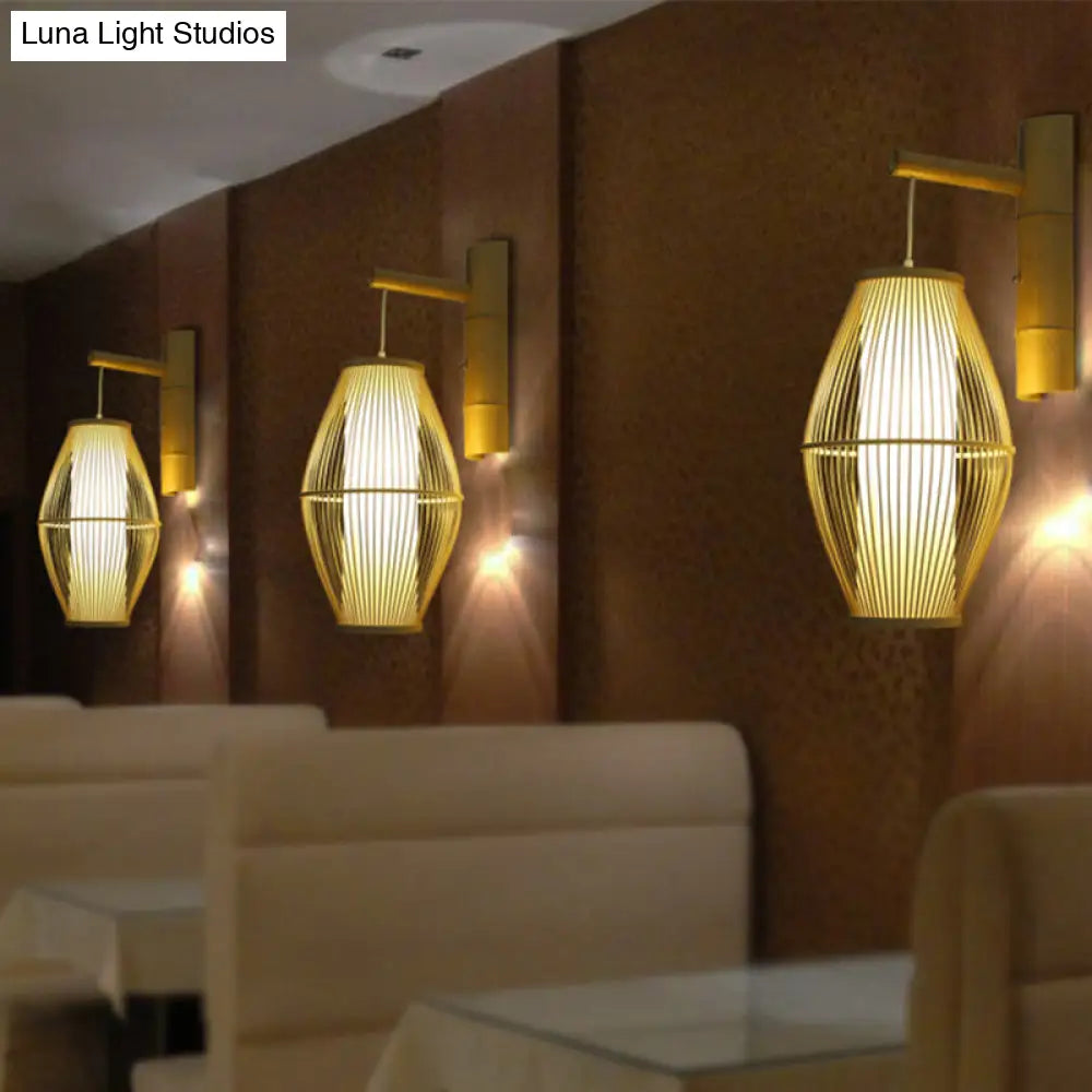 Oriental Oval Wall Light Sconce With Bamboo Lantern Design - 1-Light Beige Lamp