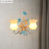 Pastoral Metal Curvy Arm Bedroom Sconce Light: 2-Head Flower Wall Lighting Fixture