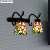 Peacock Tail Stained Glass Wall Sconce With Dual Cone Lights And Rustic Black Backplate