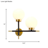 Post-Modern White Glass Sphere Wall Sconce With Brass Finish - 1/2 Bulbs