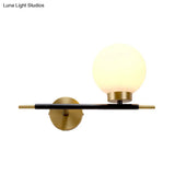Post-Modern White Glass Sphere Wall Sconce With Brass Finish - 1/2 Bulbs