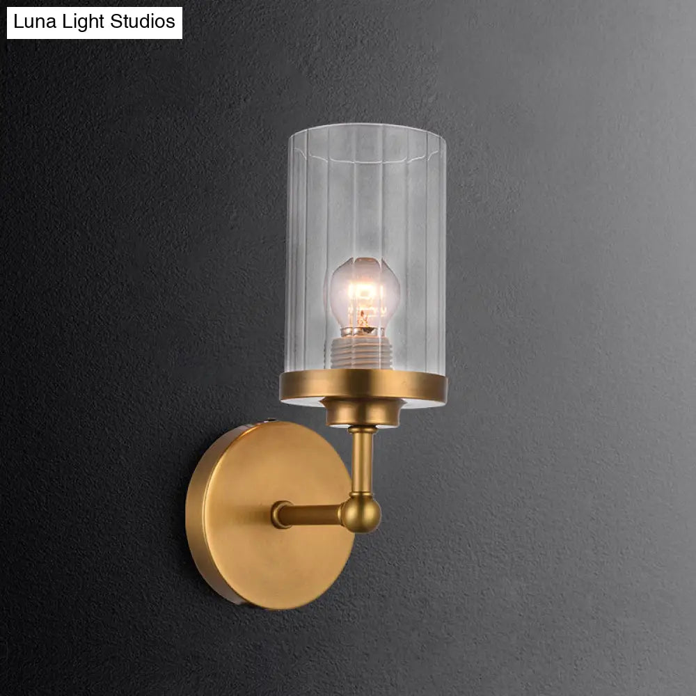 Postmodern 1-Head Brass Cylinder Wall Lighting With Clear Ribbed Glass Mount