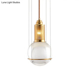Postmodern Clear Glass Ball Pendant Ceiling Light With Gold Mesh Top - Single Hanging Lamp Kit