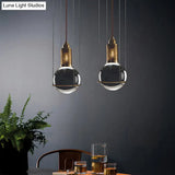 Postmodern Clear Glass Ball Pendant Ceiling Light With Gold Mesh Top - Single Hanging Lamp Kit