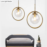 Postmodern Glass Pendant Light With Brass Ring For Bedroom - Single-Bulb Globe Down Lighting In