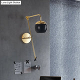Postmodern Swing Arm Wall Sconce Light With Clear Glass Shade In Black/Gold