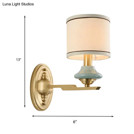 Retro Gold Fabric Wall Sconce With Porcelain Cap - Cylindrical 1/2-Light Lamp For Porch