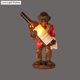 Retro Gorilla Wine Holder 1-Light Desk Lamp In Amber Glass For Night Table Red/Gold
