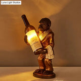 Retro Gorilla Wine Holder 1-Light Desk Lamp In Amber Glass For Night Table Red/Gold