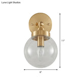 Rotatable Bedroom Wall Lamp In Brass With Clear Glass And Modernist Ball Design