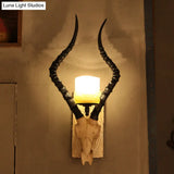 Rustic Black Gazelle Wall Sconce With Water Glass Shade - Indoor Lighting