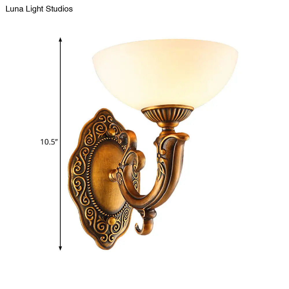 Rustic Brass Wall Sconce With Frosted Glass Shade - Swooping Arm Design For Ambient Lighting